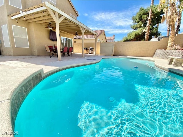 view of pool featuring a patio, a fenced backyard, a ceiling fan, and a fenced in pool