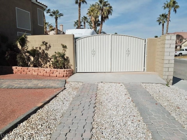 view of gate with fence