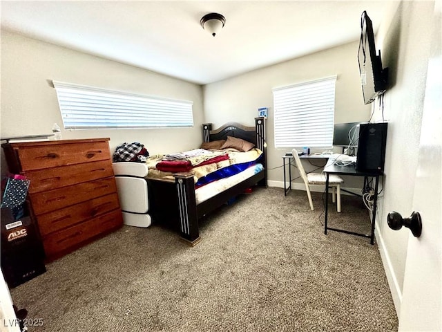 bedroom with carpet flooring and baseboards