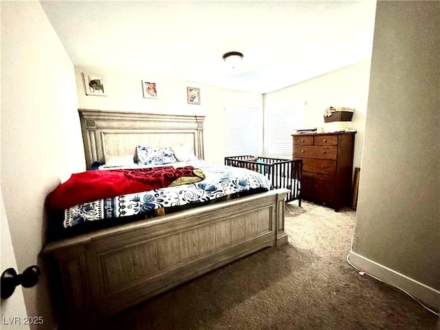 carpeted bedroom with baseboards