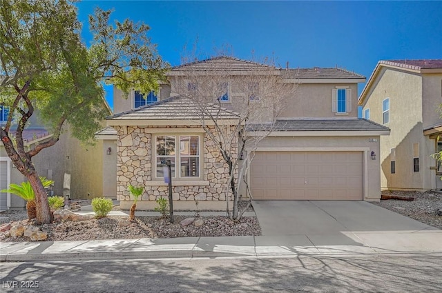 traditional-style house featuring a garage, stone siding, driveway, and stucco siding