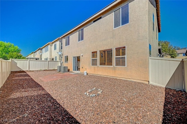 back of property featuring a patio, a fenced backyard, and stucco siding