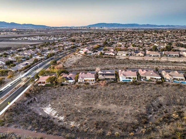 birds eye view of property with a residential view and a mountain view