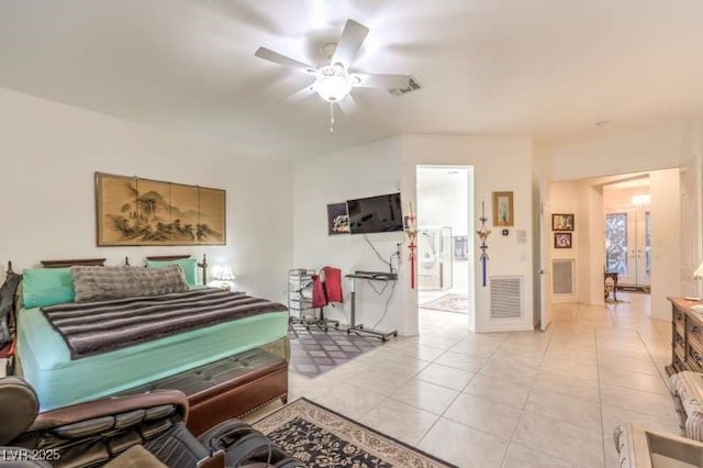 bedroom featuring light tile patterned floors, ceiling fan, and visible vents