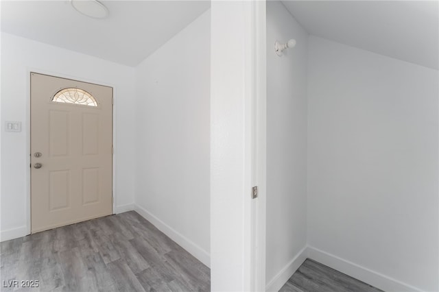 entrance foyer featuring light wood-style flooring and baseboards