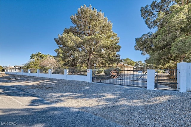 view of gate with fence