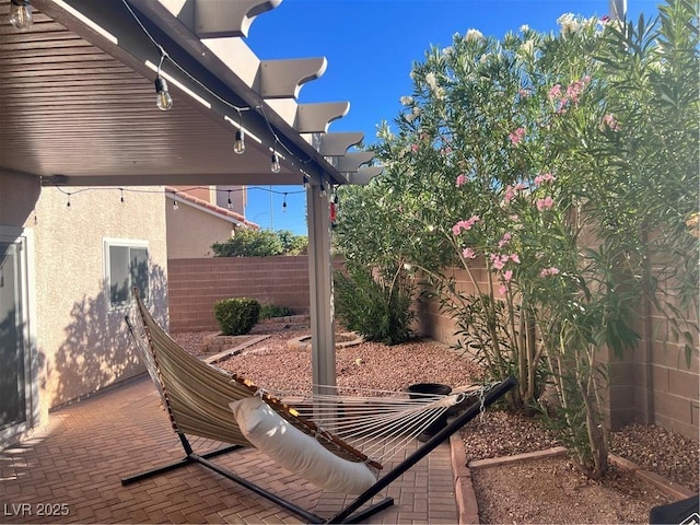 view of patio with a fenced backyard and a pergola