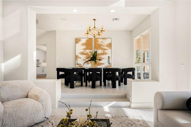 dining area with visible vents, recessed lighting, and an inviting chandelier