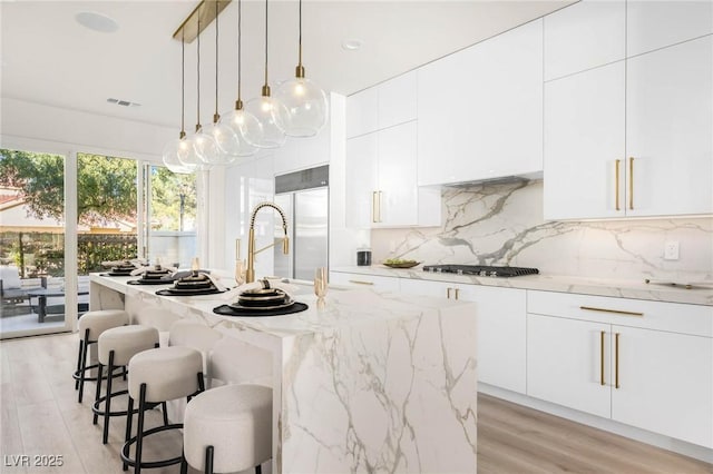 kitchen featuring white cabinetry, gas stovetop, and modern cabinets