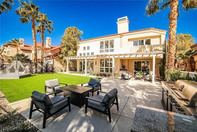 back of house with an outdoor living space, a chimney, a yard, a pergola, and a patio