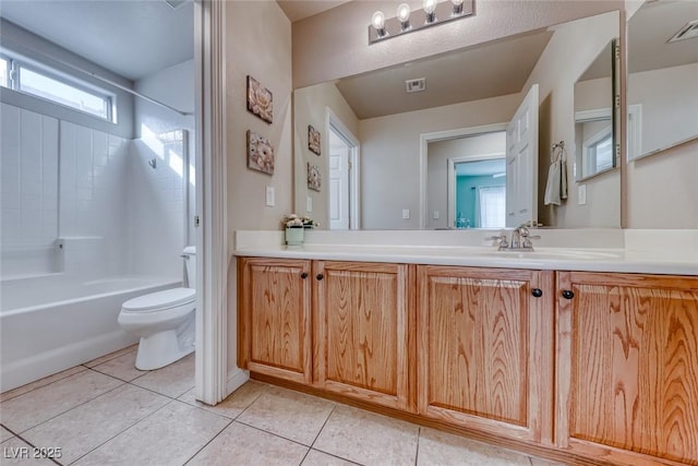 full bathroom featuring toilet, vanity, tub / shower combination, and tile patterned floors