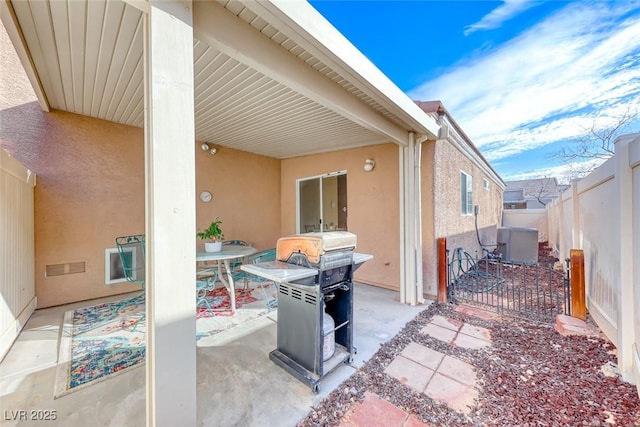 view of patio featuring a fenced backyard and visible vents