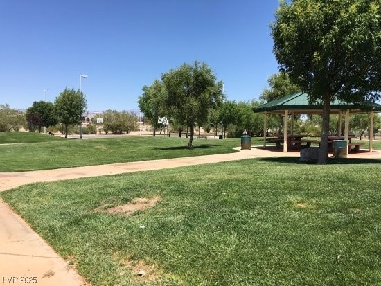 view of property's community with a gazebo and a yard