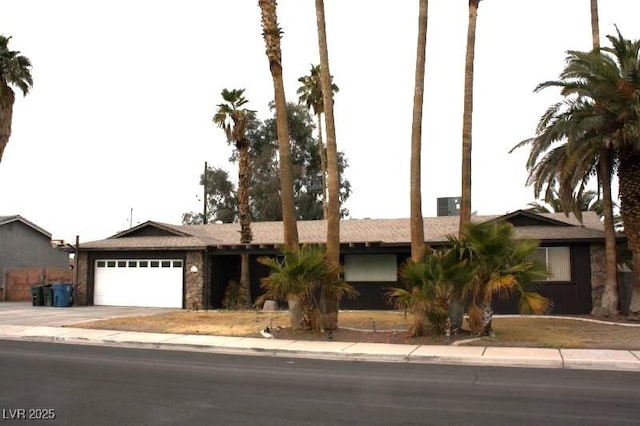 single story home with an attached garage and concrete driveway