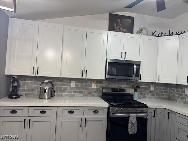 kitchen with decorative backsplash, light countertops, and appliances with stainless steel finishes