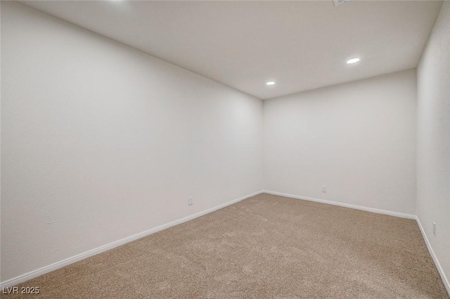 carpeted spare room with recessed lighting and baseboards