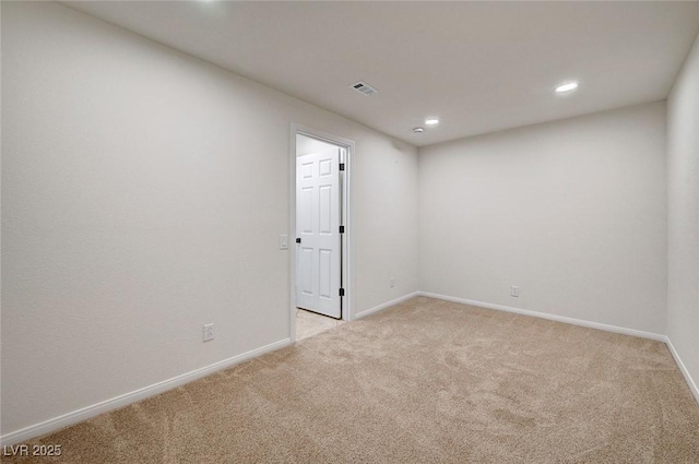 empty room with light carpet, baseboards, visible vents, and recessed lighting