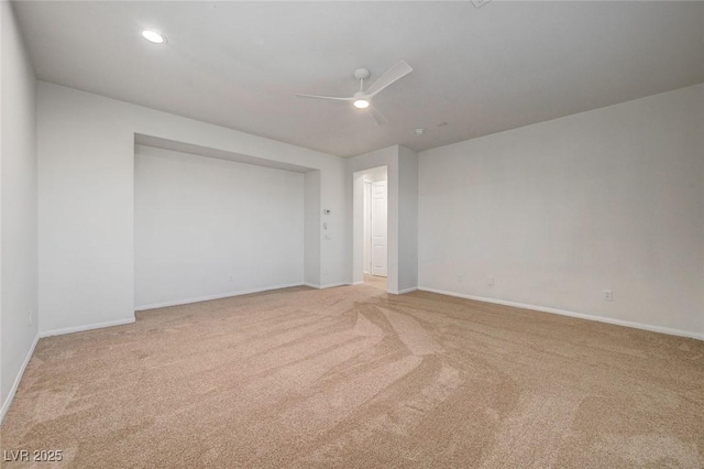 spare room with recessed lighting, baseboards, a ceiling fan, and light colored carpet