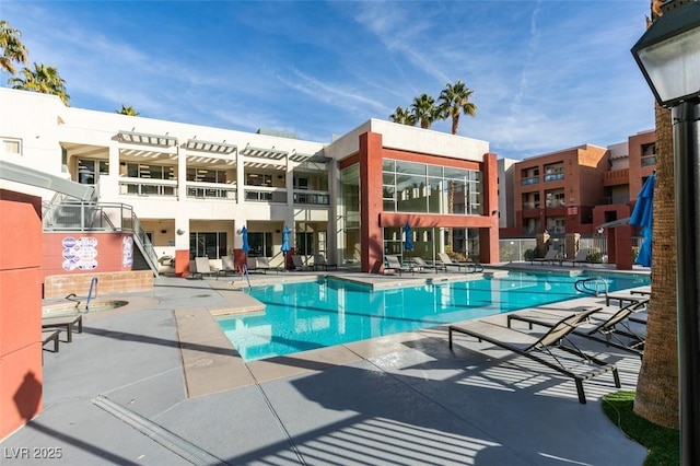 community pool featuring a patio and a pergola