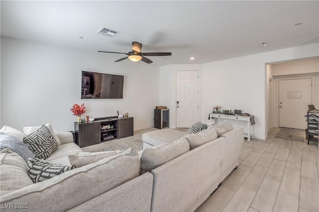 living room with ceiling fan, recessed lighting, visible vents, baseboards, and light wood-style floors