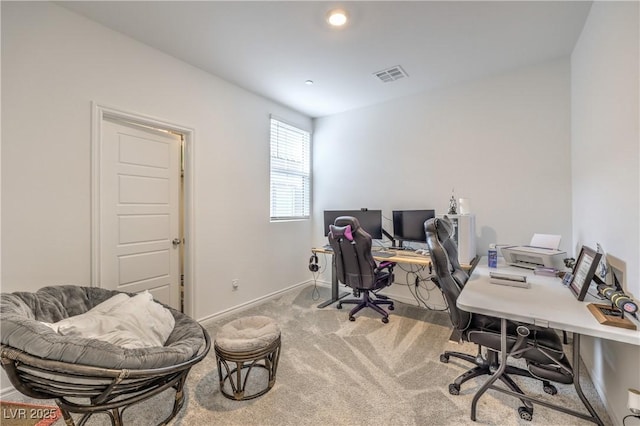 carpeted home office with visible vents and baseboards