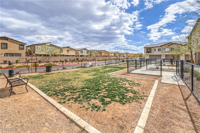 view of yard featuring a residential view and fence