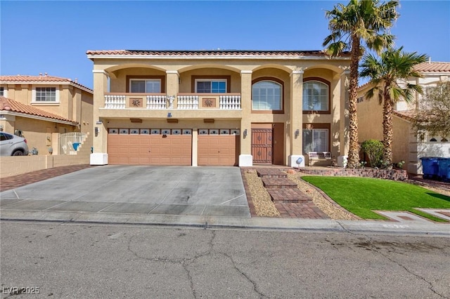 mediterranean / spanish-style home with driveway, a garage, a balcony, a tiled roof, and stucco siding