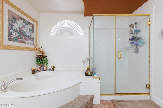 bathroom with a garden tub and a stall shower