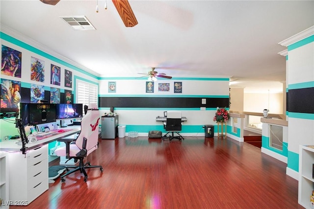 office space with visible vents and ornamental molding