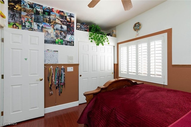 bedroom featuring a closet, dark wood finished floors, and a ceiling fan