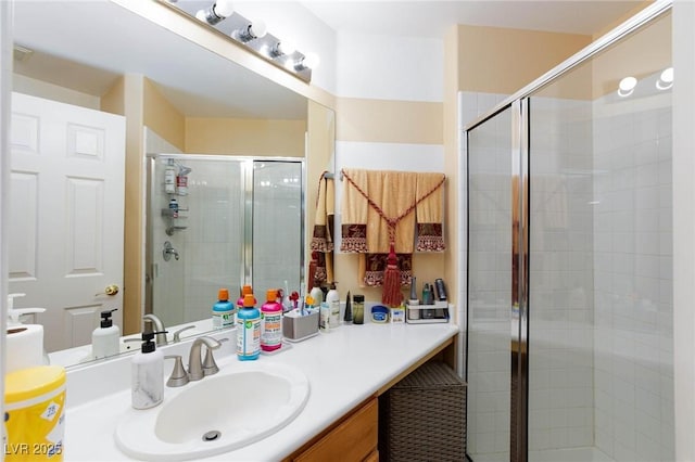 bathroom featuring a stall shower and vanity