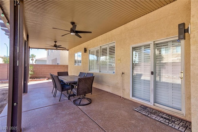 view of patio / terrace with outdoor dining area, fence, and ceiling fan