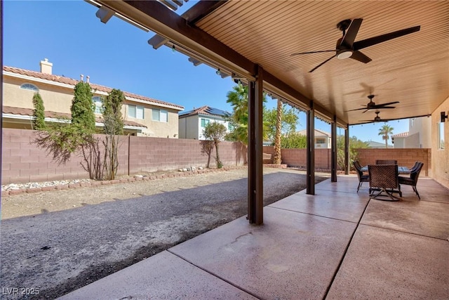 view of patio / terrace with a ceiling fan, outdoor dining space, and a fenced backyard