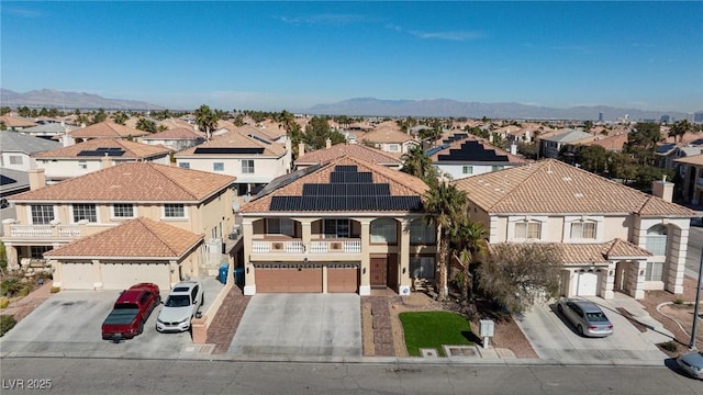 birds eye view of property with a residential view and a mountain view