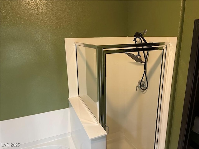 bathroom featuring a stall shower