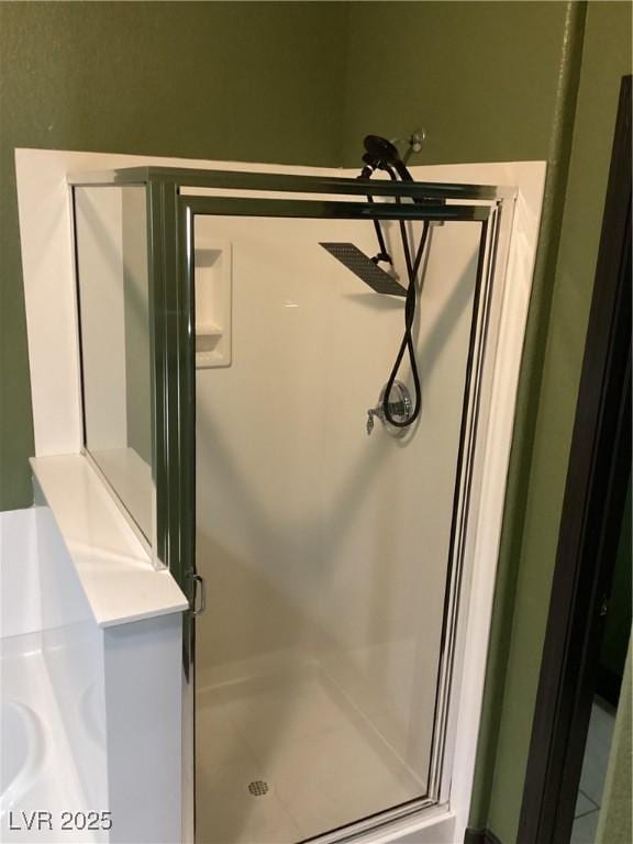 bathroom with a shower stall