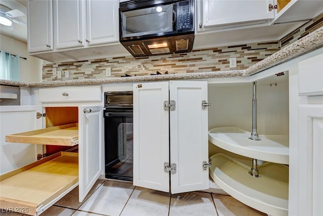 bathroom with tile patterned flooring and decorative backsplash