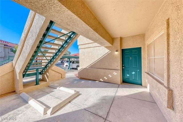 view of exterior entry with stucco siding