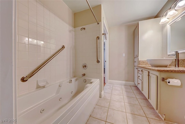 bathroom featuring a combined bath / shower with jetted tub, vanity, baseboards, and tile patterned floors