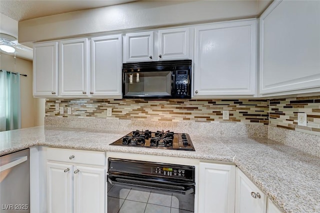 kitchen with white cabinets and black appliances