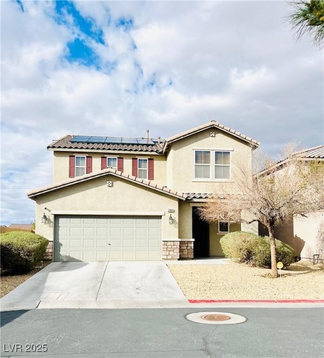 view of front of home with driveway, solar panels, stone siding, a tiled roof, and stucco siding