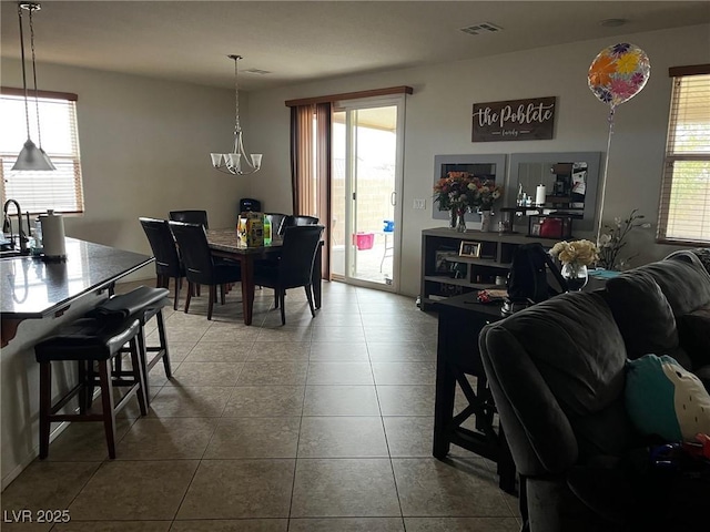 dining room featuring visible vents, plenty of natural light, and tile patterned floors