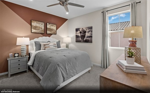 carpeted bedroom featuring baseboards and a ceiling fan