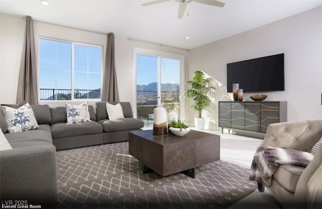 living room featuring a ceiling fan and recessed lighting