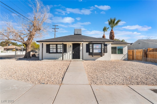 bungalow with fence private yard and stucco siding