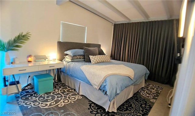 bedroom featuring lofted ceiling with beams