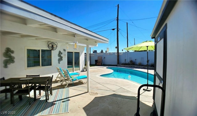 view of swimming pool with a patio area, fence, and a fenced in pool