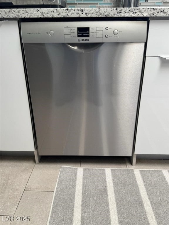 details with white cabinets and dishwasher