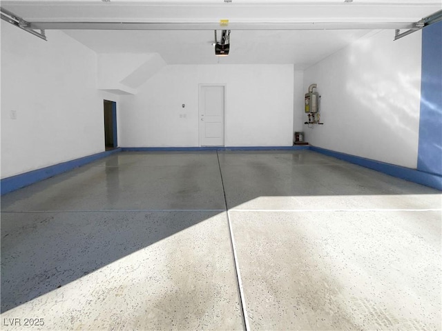 garage featuring a garage door opener, water heater, and baseboards