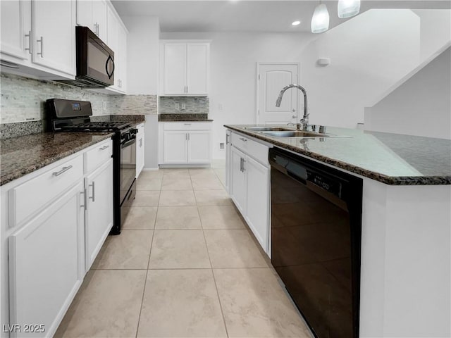 kitchen with light tile patterned floors, white cabinetry, a sink, an island with sink, and black appliances